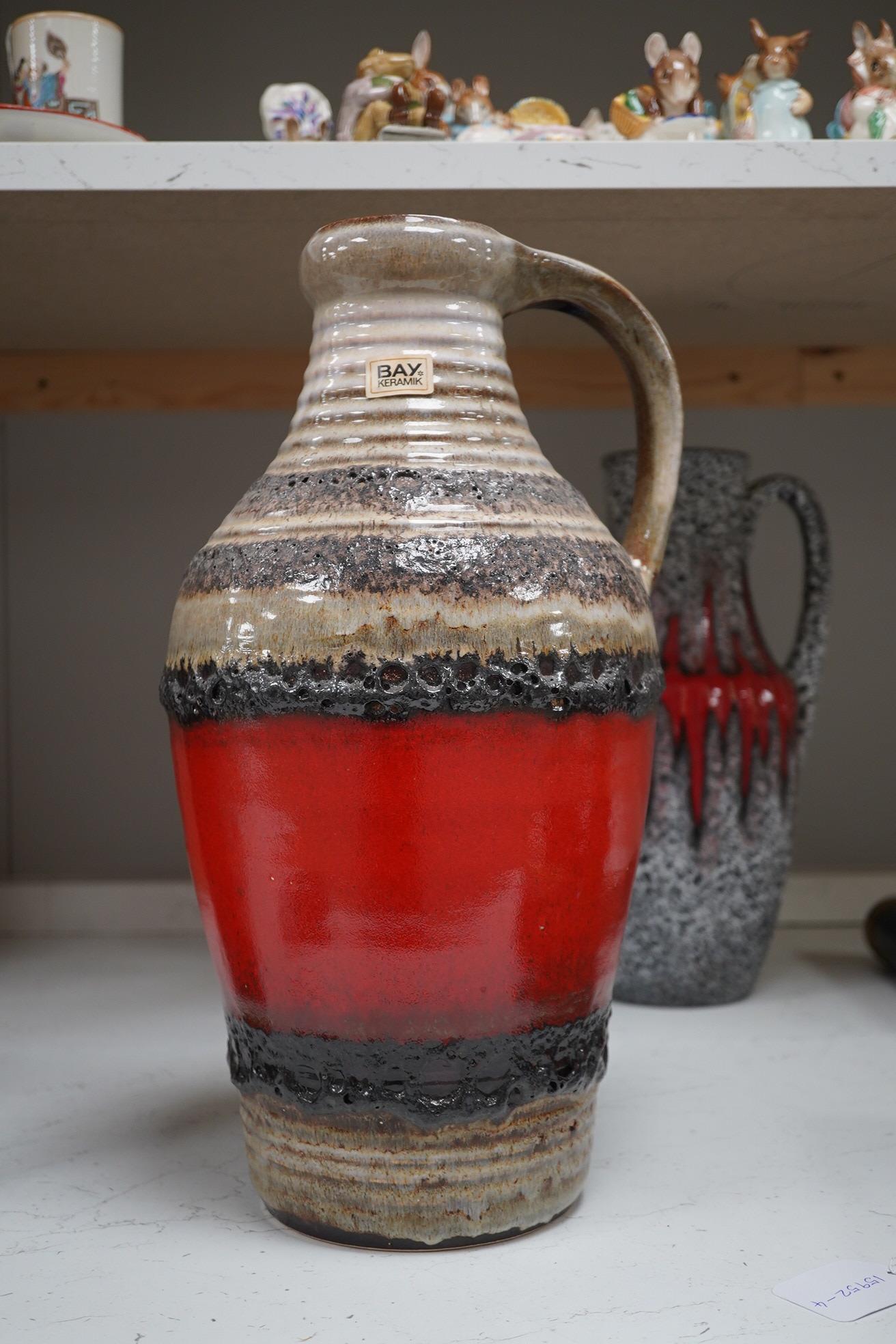 Three large West German vases including Bay and two volcanic glazed (fat lava), 42cm high. Condition - good